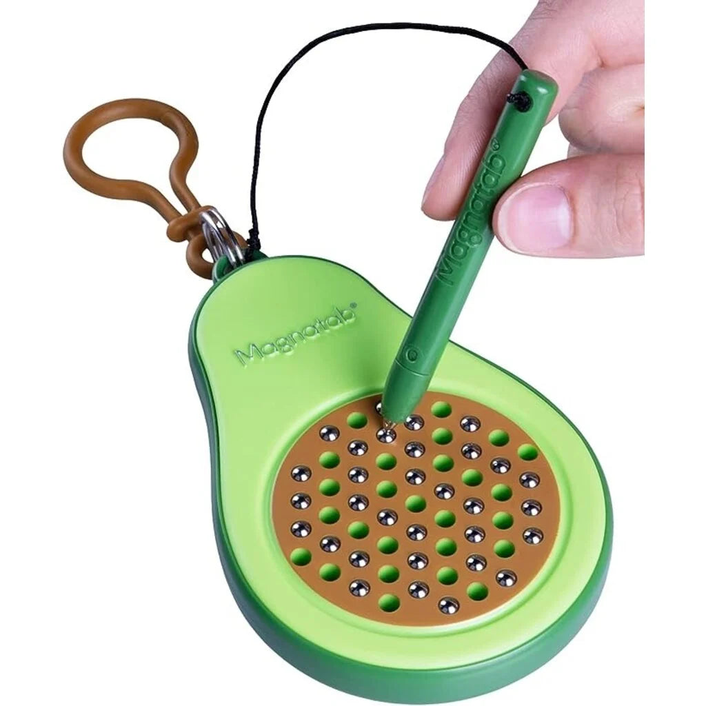 Hand using stylus on green Magnatab Mini avocado-shaped magnetic drawing toy with keychain clip for travel fun