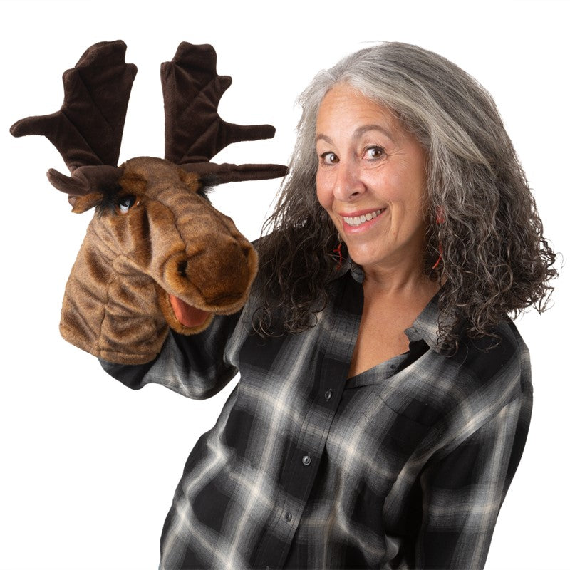 Woman smiling and holding the expressive Moose Stage Puppet with movable mouth for storytelling fun