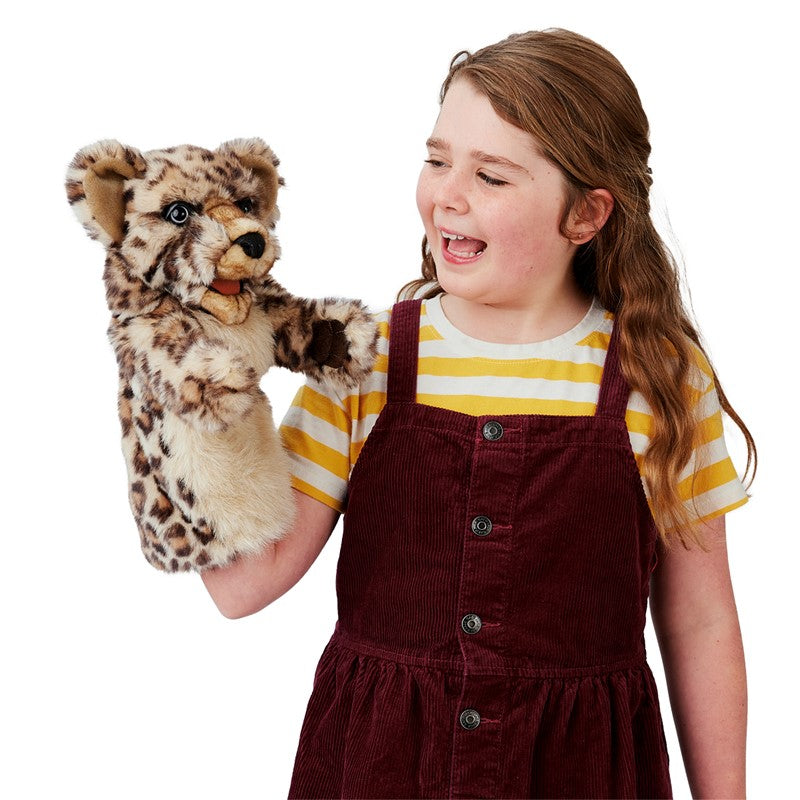 Girl happily playing with a Leopard Cub Stage Puppet featuring plush spotted fur and expressive eyes.