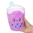 Hand holding a plush purple bubble tea snack with a smiling face, called Bubble Tea Snackers.