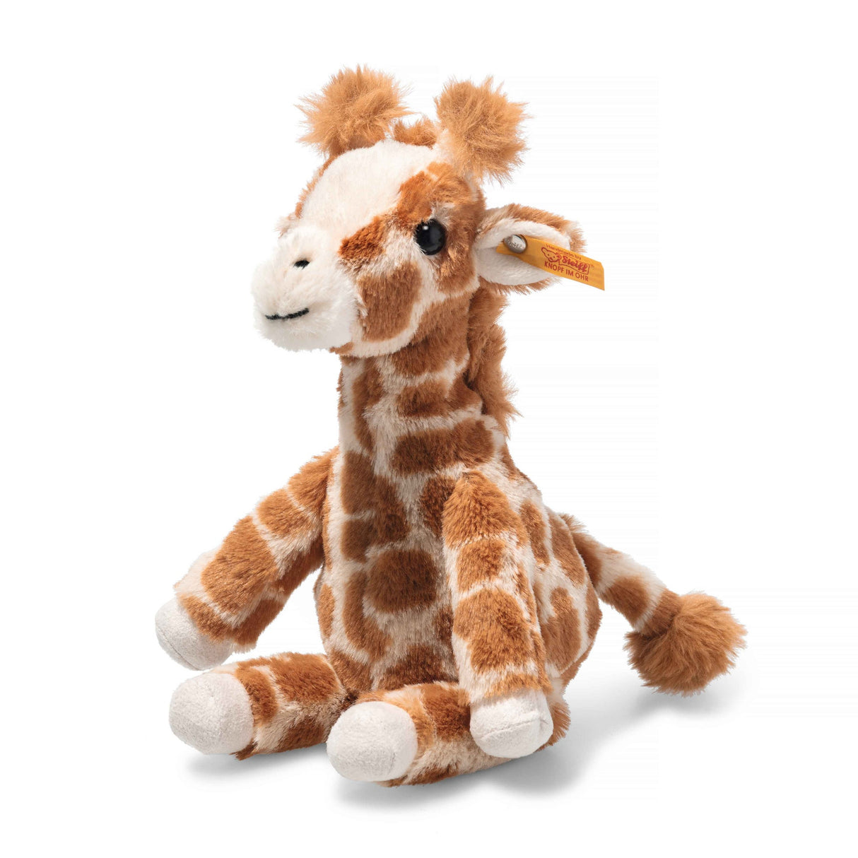 Soft cuddly giraffe toy with black eyes and plush spots sitting upright, the Giraffe Baby Gina for kids.