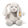 Bunny Rabbit Hoppie plush with soft gray fur, long floppy ears, pink nose, and button in ear detail sitting upright.