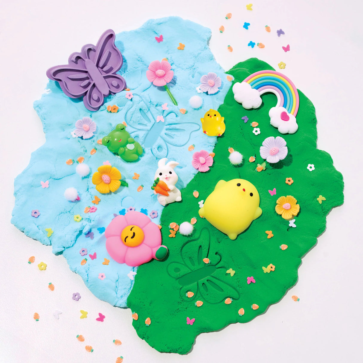 Sensory Pack | Garden Friends with blue and green cloud clay, butterfly stamp, bunny, chick, rainbow, and sensory toys on white background.