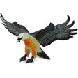 Bearded Vulture toy figure in flying pose with spread wings, detailed gray wings, cream head, and rust-colored underside.