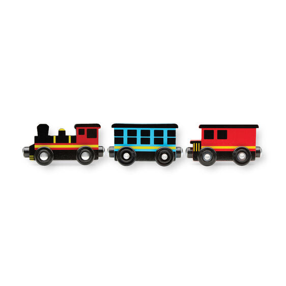 Three colorful wooden train cars included with the Round the Rails Train Rug for imaginative play.