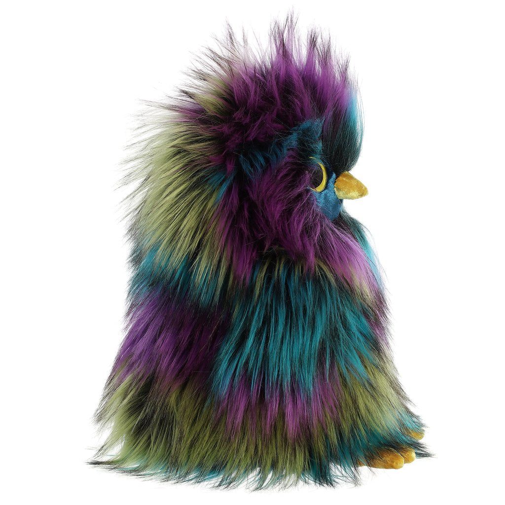 Owl Eden plush featuring dark purple, teal, black, and yellow fur with round eyes and fluffy wings, 10 inches tall.