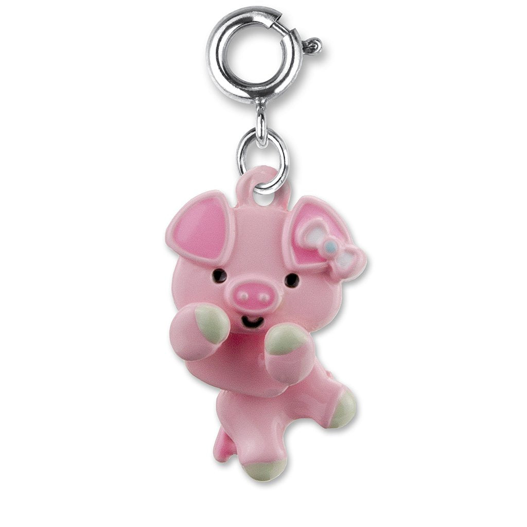 Swivel Pig Charm featuring a pink enamel pig with a bow, designed to swivel on bracelets or necklaces.