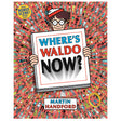 Where's Waldo Now? book cover featuring Waldo holding a sign amid a busy crowd of colorful characters.
