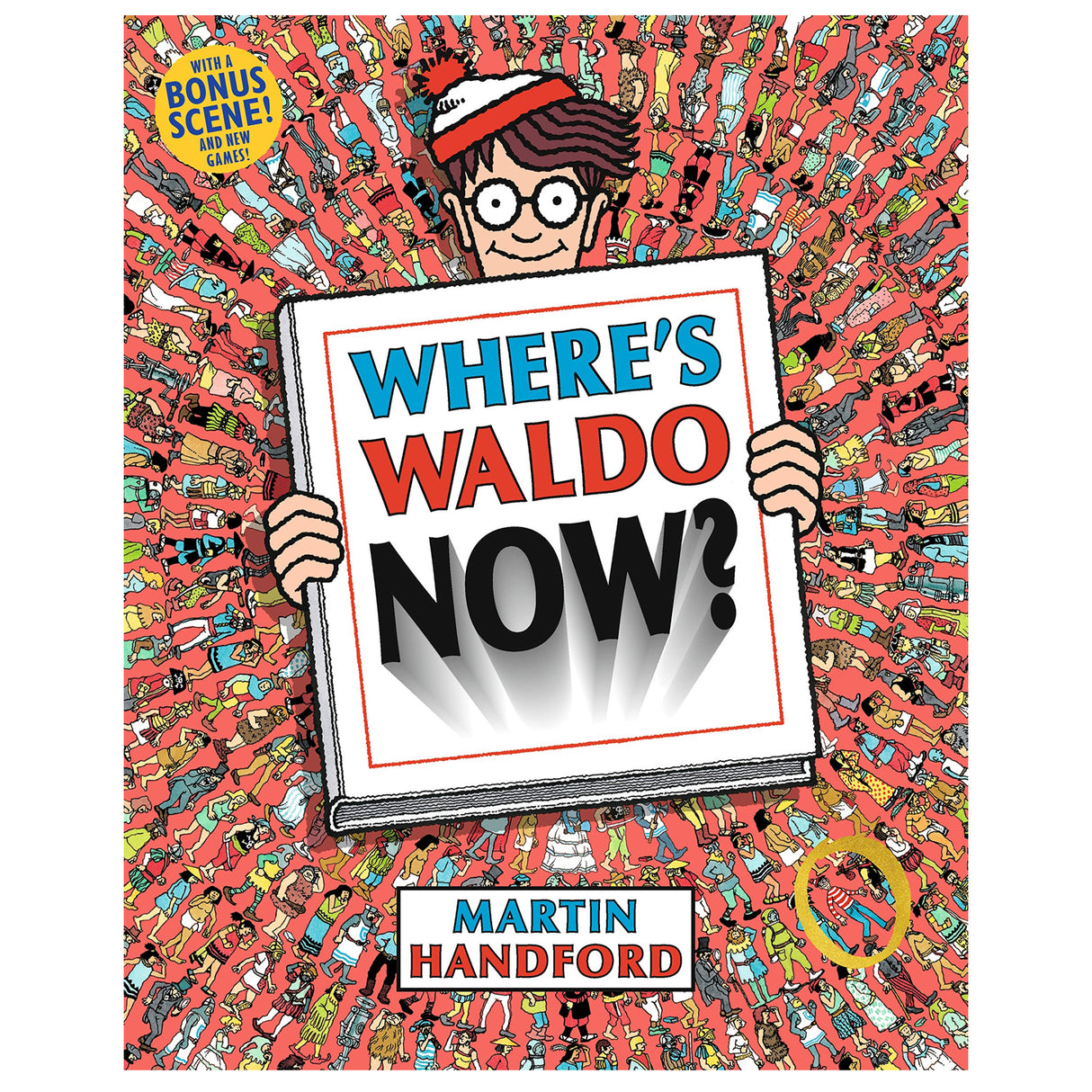 Where's Waldo Now? book cover featuring Waldo holding a sign amid a busy crowd of colorful characters.