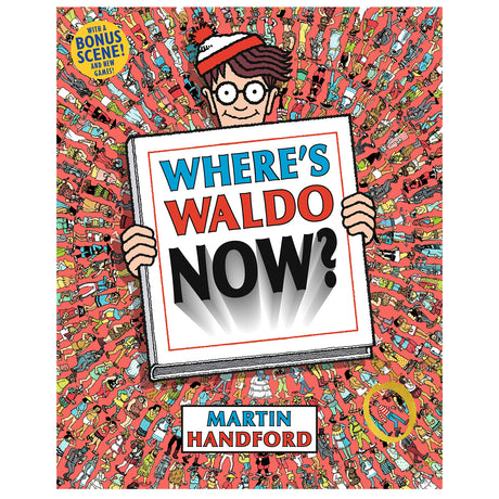 Where's Waldo Now? book cover featuring Waldo holding a sign amid a busy crowd of colorful characters.