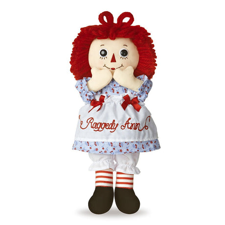 Classic Raggedy Ann doll with red yarn hair, candy-cane striped tights, and vintage-inspired dress, 12 inches tall.