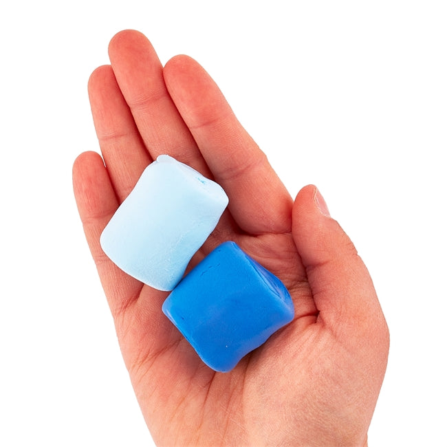 Hand holding two soft clay pieces in light and dark blue from Creatibles Air Dry Clay Kit for sculpting projects.