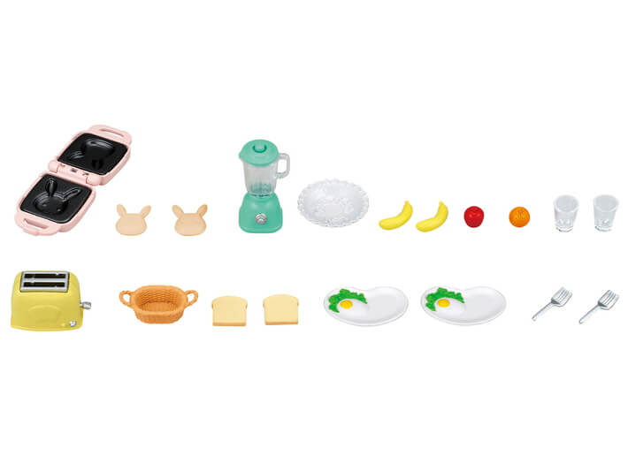 Breakfast Playset with toaster, sandwich maker, blender, plates with eggs, fruit, cups, and utensils for imaginative play.