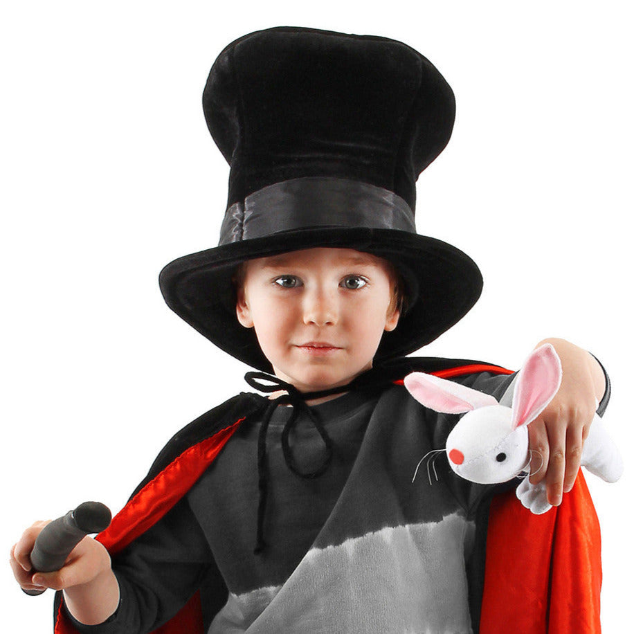 Child wearing Magician Hat w/Rabbit holding a wand and plush white rabbit in magician costume.