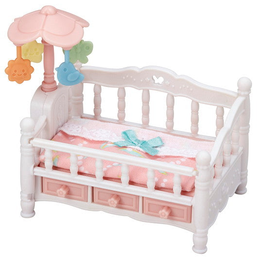 Crib with Mobile featuring a side flower dial to rotate the mobile and drawers underneath for storage.