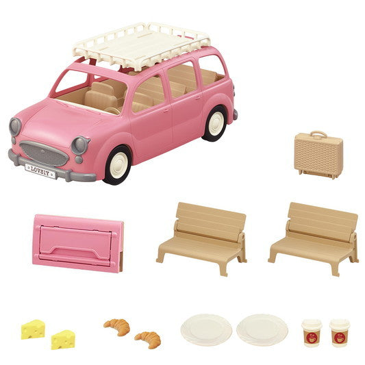 Pink Family Picnic Van toy set with seats, picnic table parts, plates, croissants, cheese, and drinks accessories.