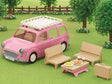 Pink Family Picnic Van toy with removable picnic table, benches, food accessories, and play basket set in grassy park.