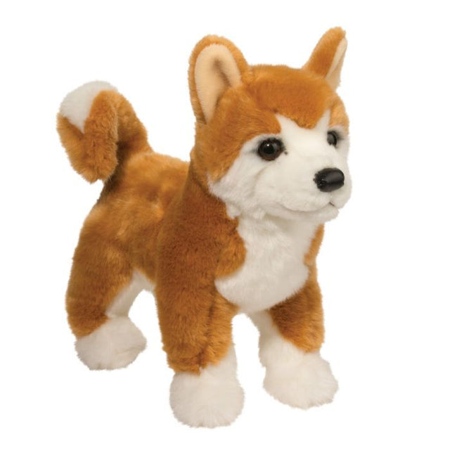 Shiba Inu Dunham plush toy standing upright with golden orange coat, curled tail, and black leatherette nose.