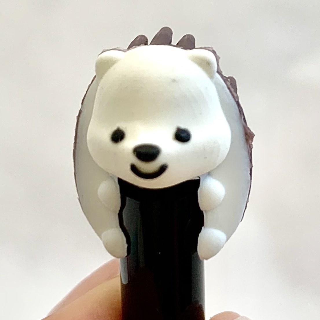 Close-up of Hedgehog Gel Pen with retractable black ink and soft sensory rubber brush back in assorted colors.