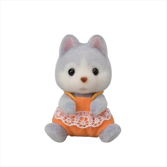 Husky Twins baby figure Amber sitting in an orange dress with white lace, soft plush toy for kids ages 3 and up.