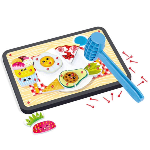Tap Tap Set Food with colorful food-shaped pegs and a blue hammer for creative pounding fun.