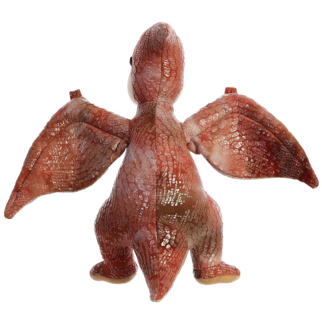 Pteranodon plush toy with large maroon wings, textured fabric, and realistic patterned scales, standing on hind legs.
