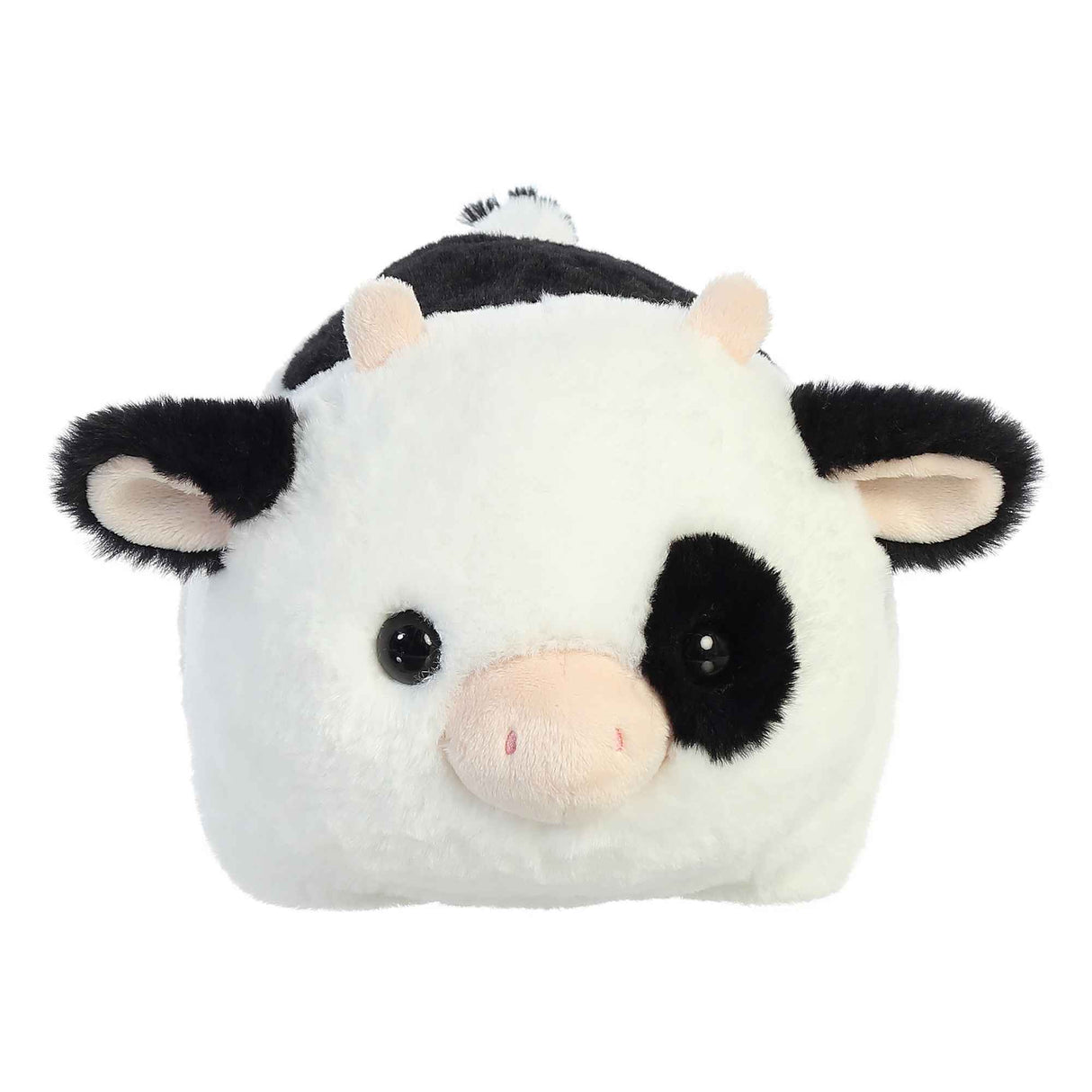 Spudster Cow Tutie plush with soft white and black body, folded ears, plush horns, and round cuddly shape.