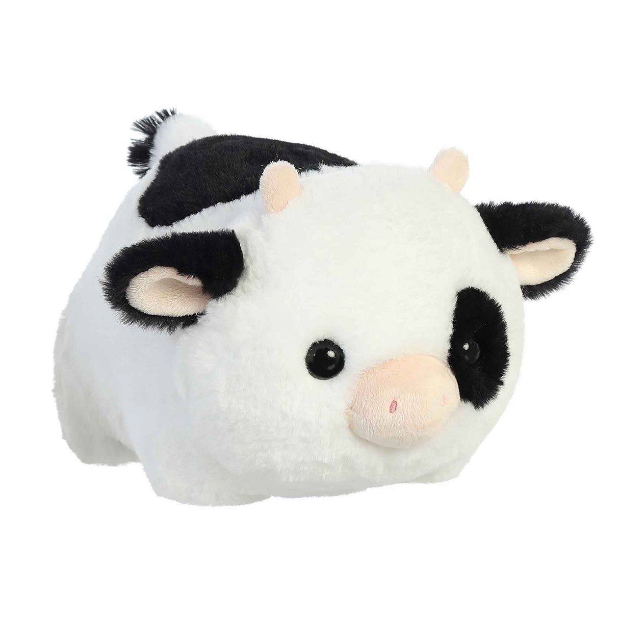 Spudster Cow Tutie plush toy with soft white and black fur, folded ears, plush horns, and round potato-shaped body.