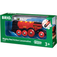 Mighty Red Locomotive toy train in packaging with red and black design, lights, sound effects, and age 3+ label.
