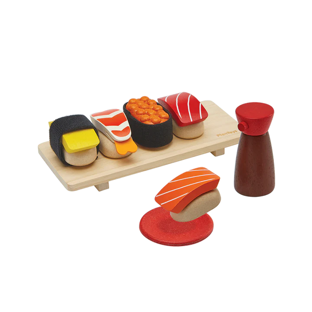 PlanToys Sushi Set with wooden sushi pieces, tray, shoyu bottle, and sauce dish for pretend play.