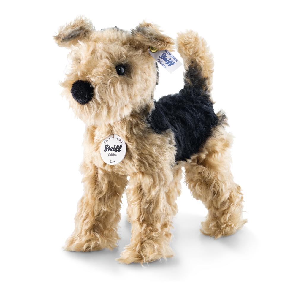 Terri Welsh Terrier plush in goldenbrown and black mohair with brass plated button in ear, approx. 10 inches tall.