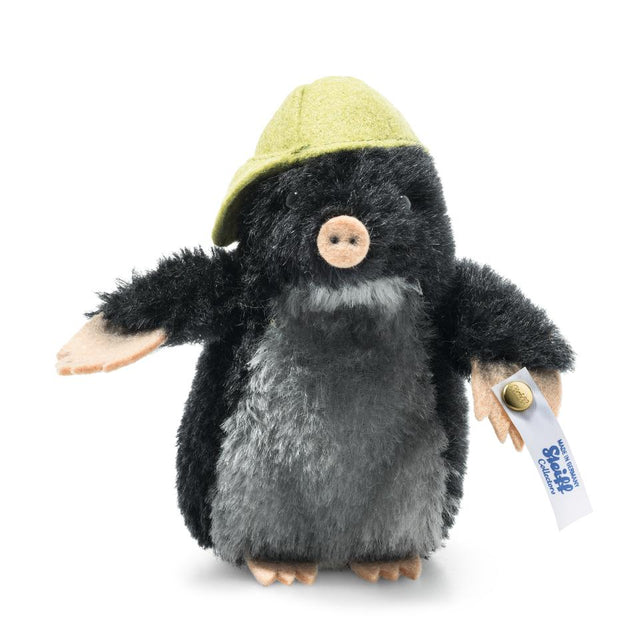 Maxi Mole plush collectible with black and gray mohair, pink felt paws, nose, and yellow felt cap, handmade in Germany.