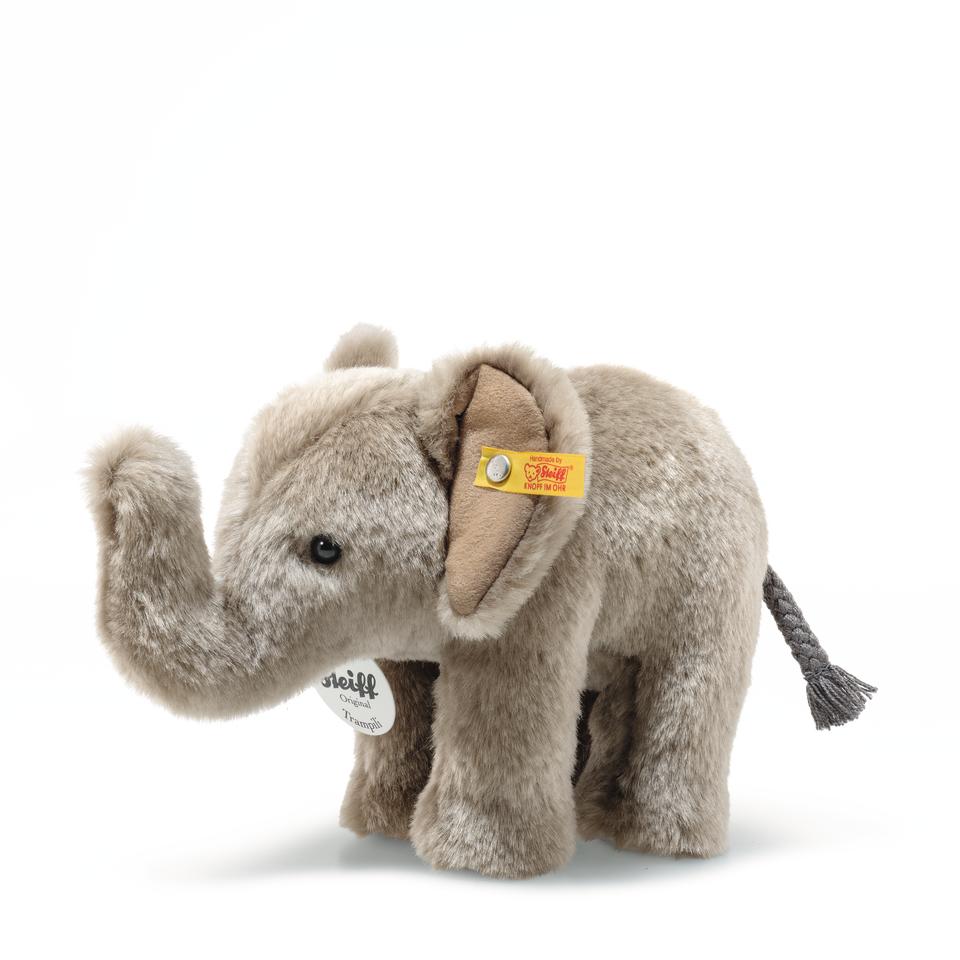 Trampili Elephant plush by Steiff, soft gray hand-crafted elephant with safety eyes and yellow ear tag, 7 inches tall.