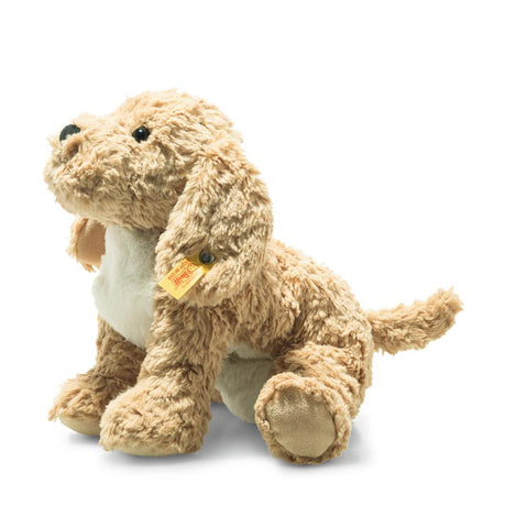 Soft Cuddly Friends Berno Goldendoodle plush dog with curly beige coat, white chest, safety eyes, and yellow button ear tag.