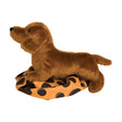Soft and detailed 8-inch Dachshund Dilly plush toy lying on a polka dot fabric, perfect for kids 24 months and up.