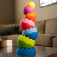 Tobbles Neo colorful, uniquely contoured stacking toy with six weighted pieces for sensory and motor skills play.