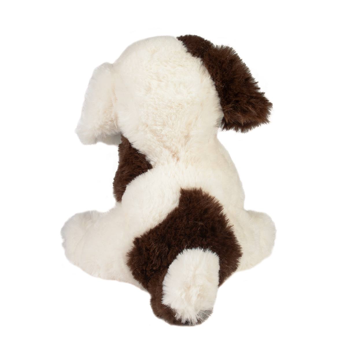 Puppy Donnie plush toy showing chocolate brown spots on creamy soft coat sitting with back facing forward.