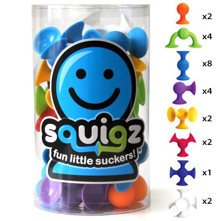 Clear container of colorful Squigz silicone toy pieces in various shapes and quantities, showcasing the Squigz product.