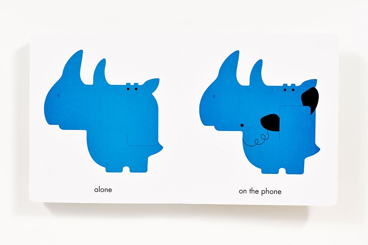 Rhymoceros shows a blue rhinoceros alone and on the phone demonstrating rhyming words in a children's book.