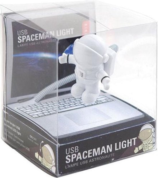 USB Astronaut Light showing a small spaceman figure attached to a flexible USB cord in retail packaging.