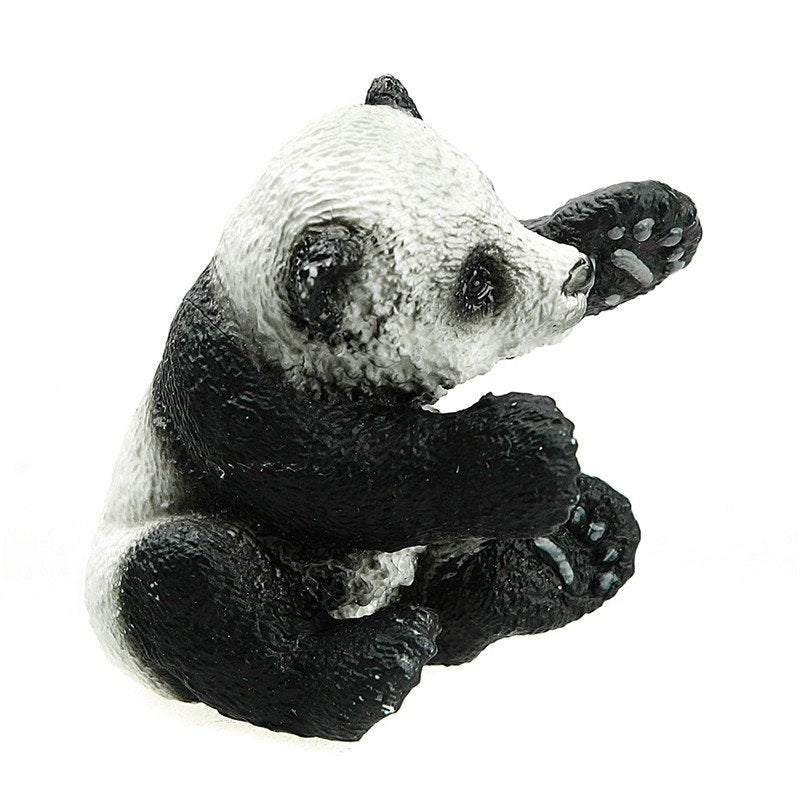 Panda Cub figurine playing with paws raised, detailed texture captures the charm of a playful baby panda cub.