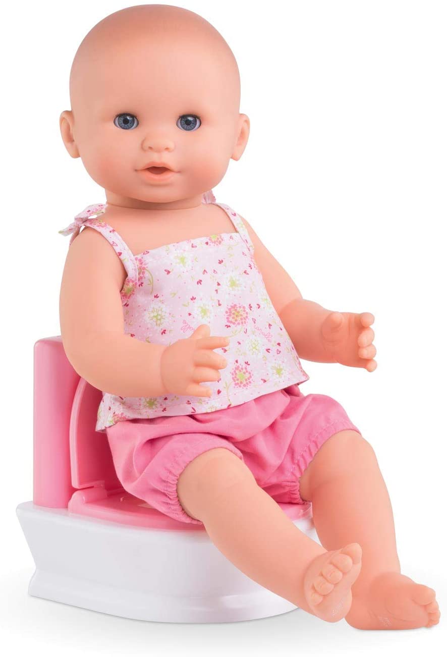 Interactive Toilet with baby doll sitting on pink and white potty learning to use the toilet with sound features included.