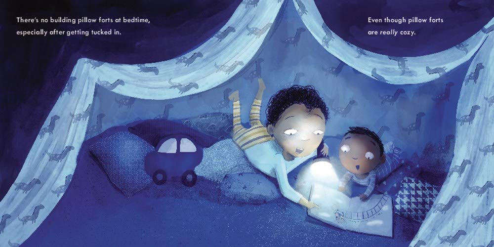 Illustration from It’s Big Brother Time showing big brother reading a book to baby under a cozy pillow fort at bedtime.