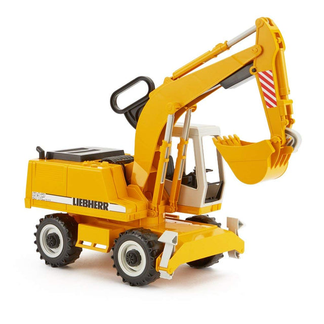 Liebherr Power Shovel toy with fully functional shovel arm and 360° rotating cab, detailed in yellow and white plastic.