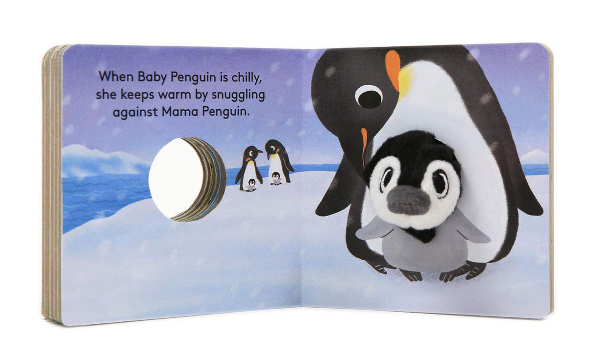 Baby Penguin with Finger Puppet board book open to cozy scene of baby penguin snuggling with mama penguin.