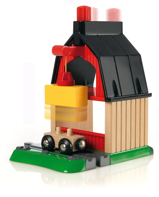 Farm Railway Set featuring a wooden crane lifting hay over a small train wagon on green tracks.