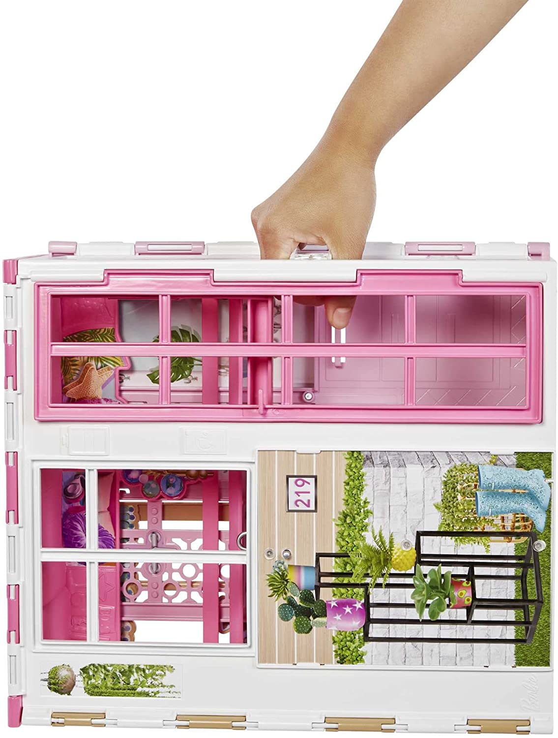 Barbie House and Doll shown folded with hand carrying, featuring pink windows and detailed exterior.