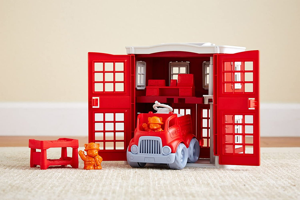 Fire Station Play Set with red fire station, fire engine, firefighter cat figure, and furniture pieces for imaginative play.