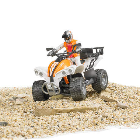 Quad with Driver toy in orange and white, with rugged tires and a removable luggage rack on gravel terrain.
