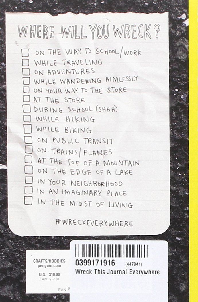 Checklist of creative prompts on paper for Wreck This Journal Everywhere by a sidewalk curb